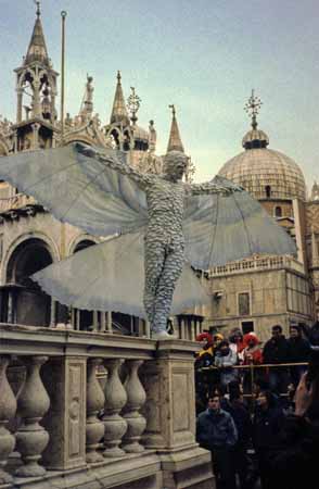 A mask of a dove with open wings in front of St. Marco's Basilica - Masks at the Venice Carnival, JBLArts photography