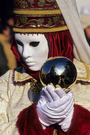 A white mask handing a reflecting sphere - Masks at the Venice Carnival, JBLArts photography