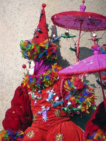 A red clown with coloured strings and violet umbrella - Masks at the Venice Carnival, JBLArts photography