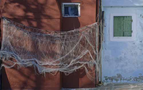 A drying net on a red wall - Burano in Venice, JBLArts photography